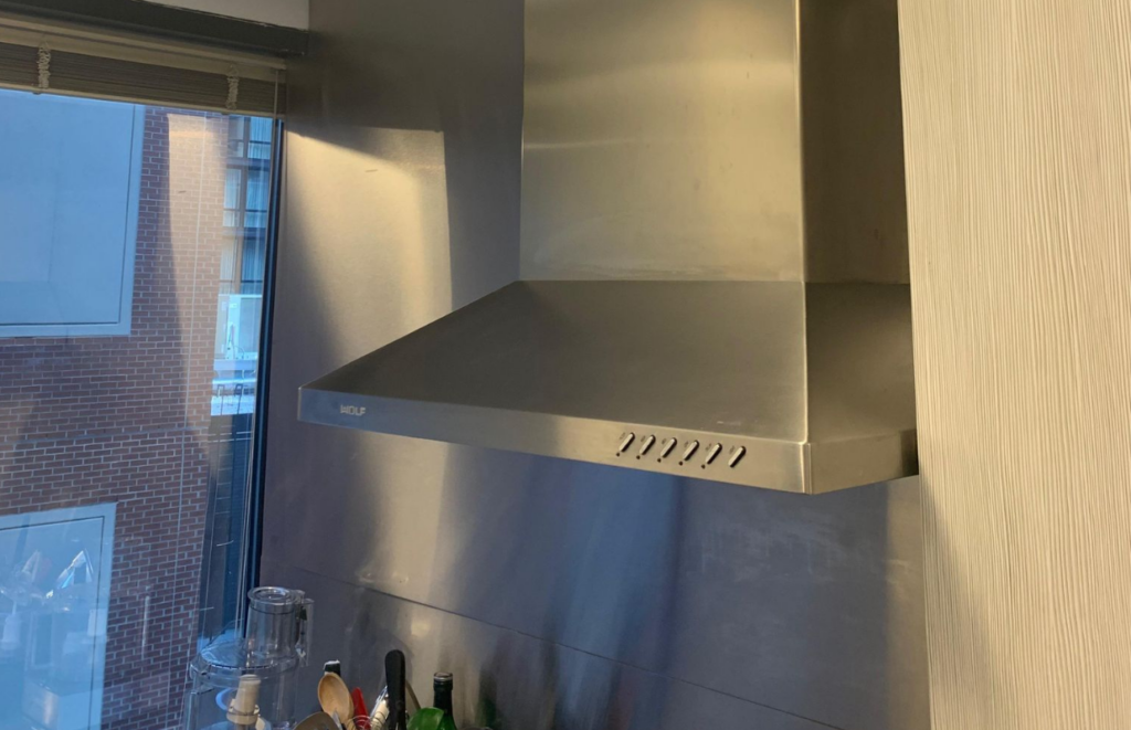 Kitchen Hood Installed and vented to side of the townhouse